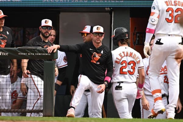 Safety First: Orioles Manager Craig Albernaz Dons Catcher’s Mask in Dugout After Scary Injury